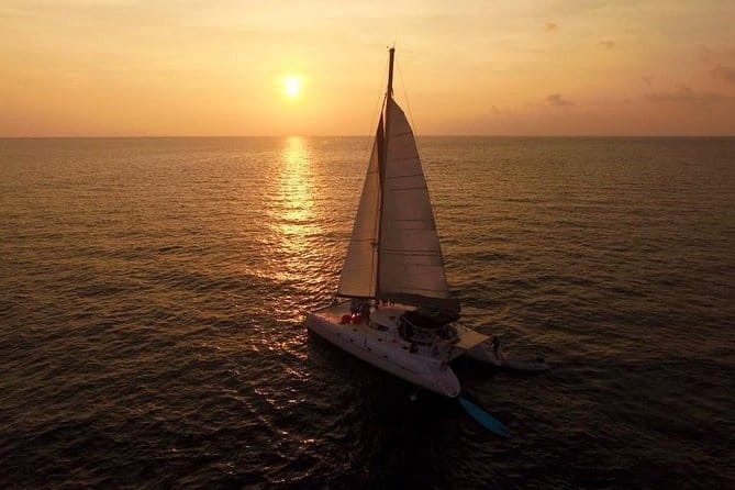 Phuket: Aeolos Catamaran Tour to Coral & Racha Islands + Lunch - Sunset sailing past Promthep Cape