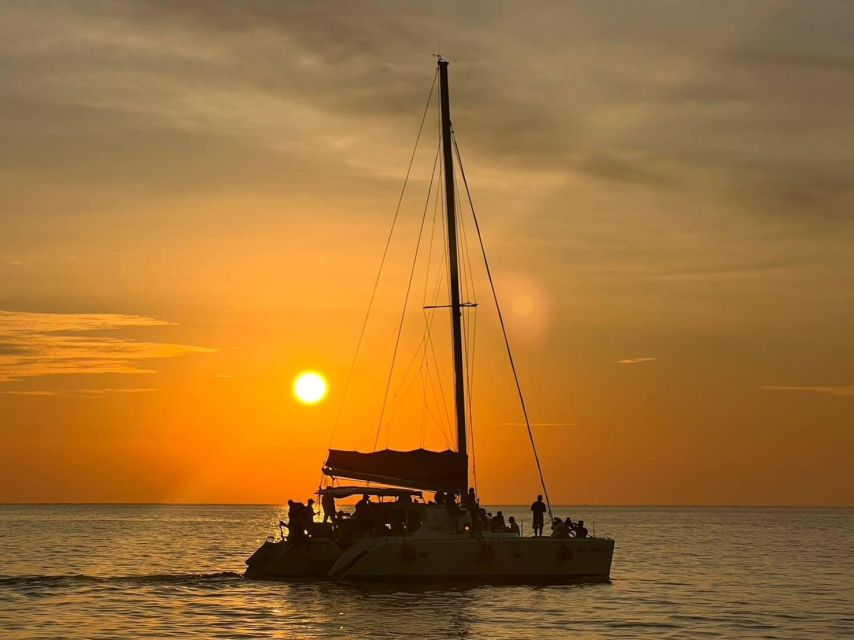 Phuket: Coral Island & Sunset Dinner by Sailing Catamaran - Snorkeling, swimming, and optional water sports